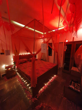 Classic bed net wedding room decoration Karachi with balloons and fairy lights – image 1