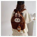 Brown kids plush backpack with bunny ears and doll keychain