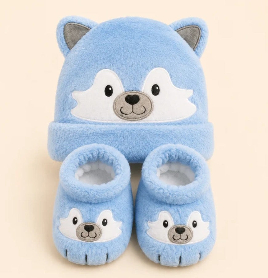 Blue husky baby cap and booties close up