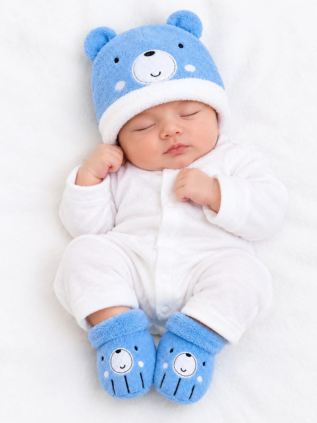 Baby wearing blue teddy winter cap