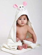 Baby wearing white lamb hooded towel