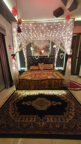 Hanging real flowers wedding room decor Karachi with white net and fairy lights – image 1