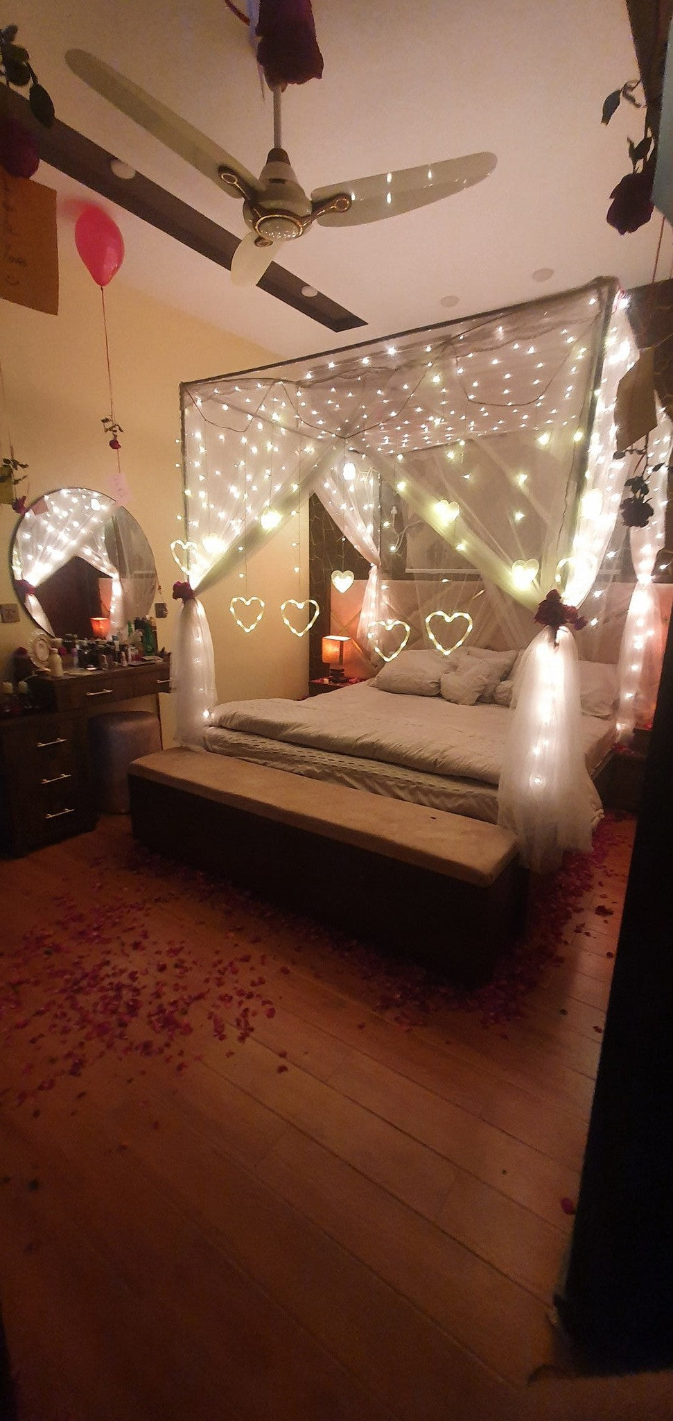 Heart foil balloons wedding room decor Karachi with love notes and rose petals – image 4