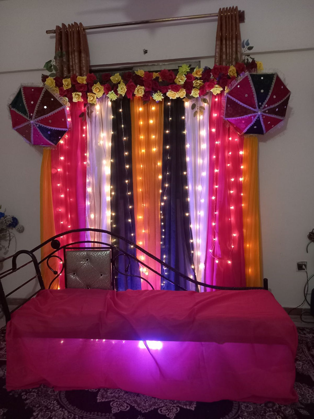 Mehndi decoration package 1 Karachi colourful curtain backdrop with fairy lights and umbrellas – image 1