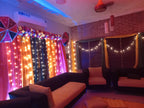 Dholki decoration at home Karachi with pink yellow green fairy light curtain backdrop – image 7