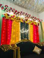 Mehndi night decoration Karachi with neon sign floral topper and fairy light curtains – image 1