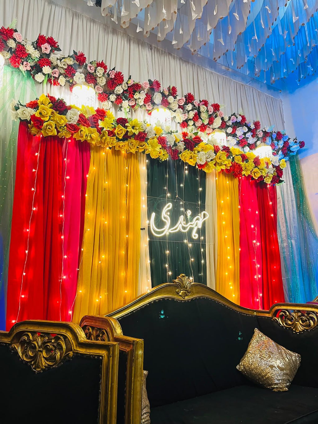 Mehndi night decoration Karachi with neon sign floral topper and fairy light curtains – image 3