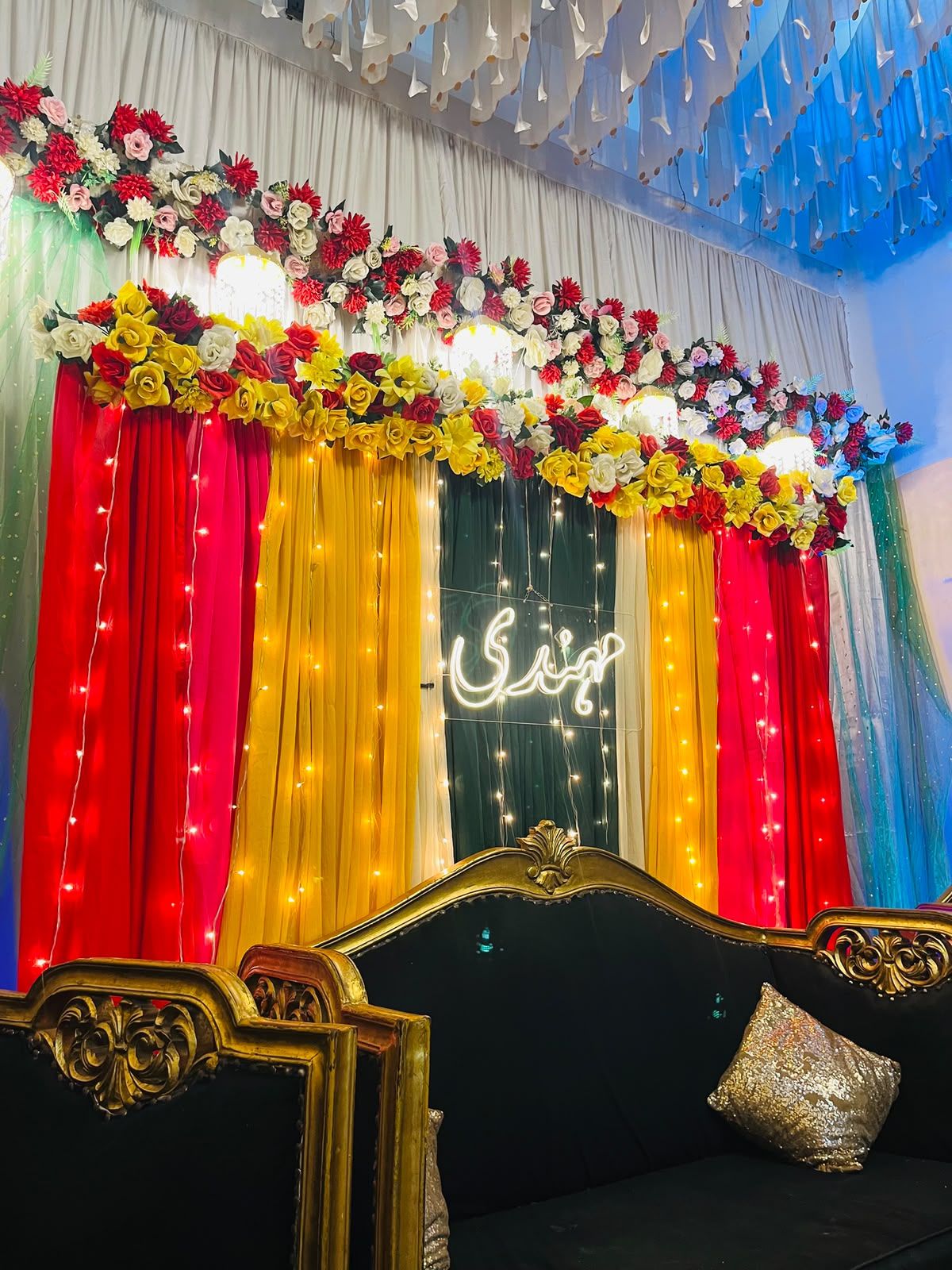 Mehndi night decoration Karachi with neon sign floral topper and fairy light curtains – image 3