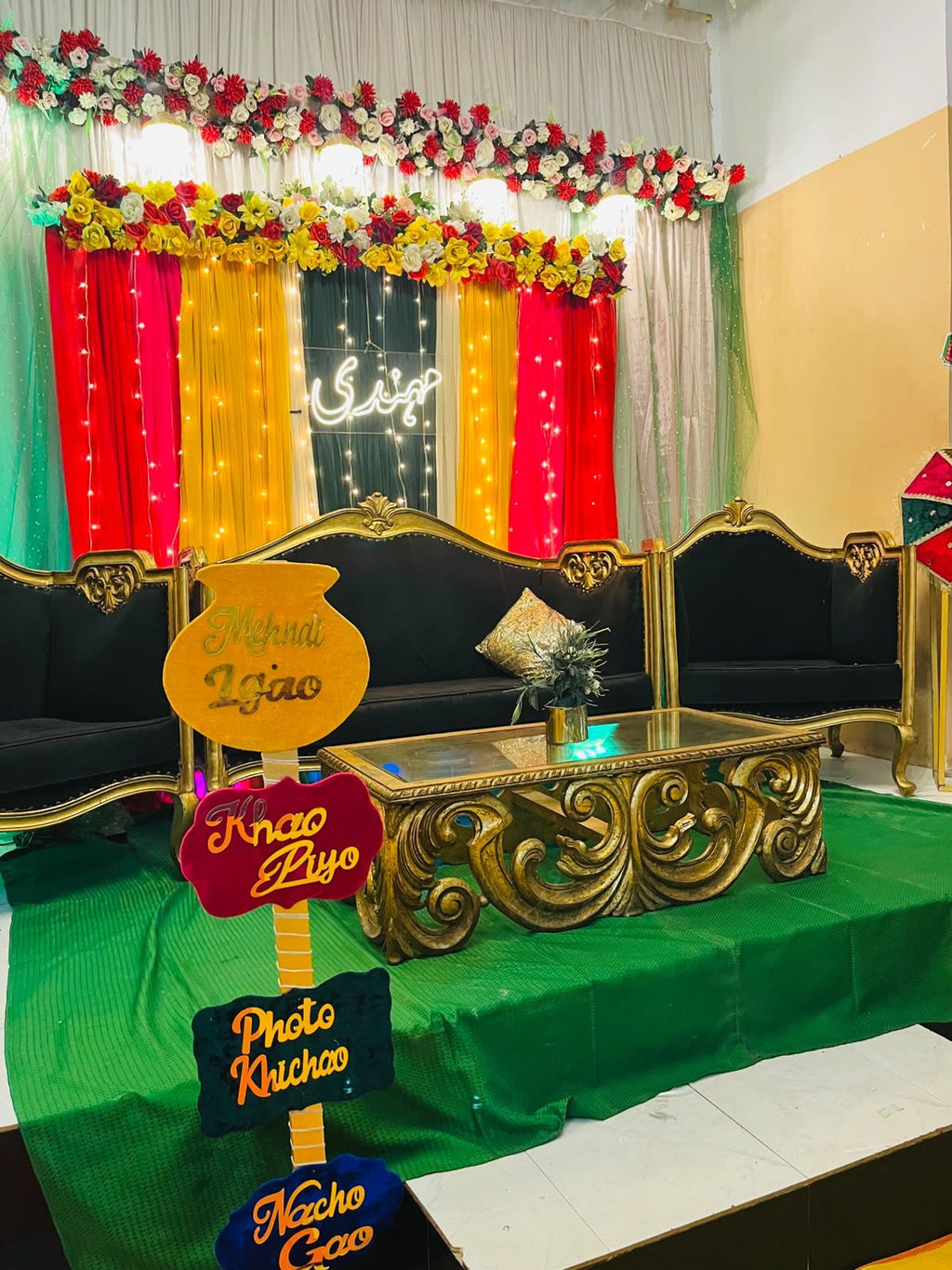 Mehndi night decoration Karachi with neon sign floral topper and fairy light curtains – image 4
