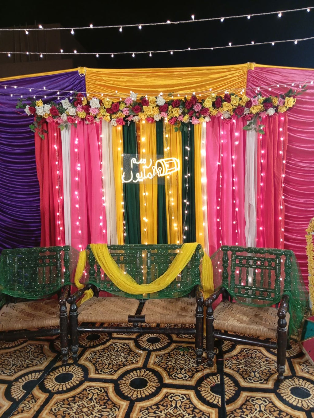 Rooftop dholki decoration Karachi with colourful curtain backdrop and fairy light canopy – image 1