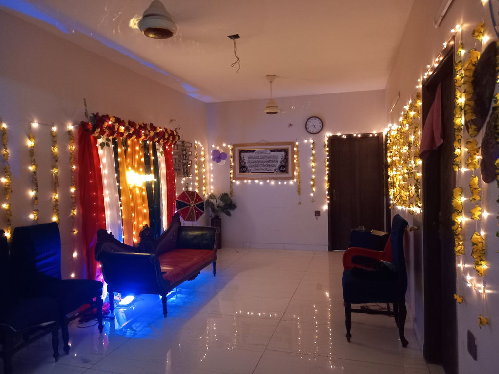 Mayun decoration Karachi with neon sign fairy light walls and colourful curtain backdrop – image 7