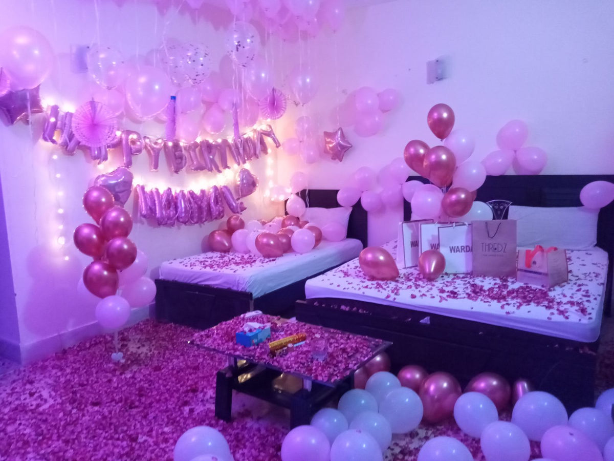 Pink and rose gold surprise birthday anniversary room decoration Karachi with balloons and rose petals – image 5