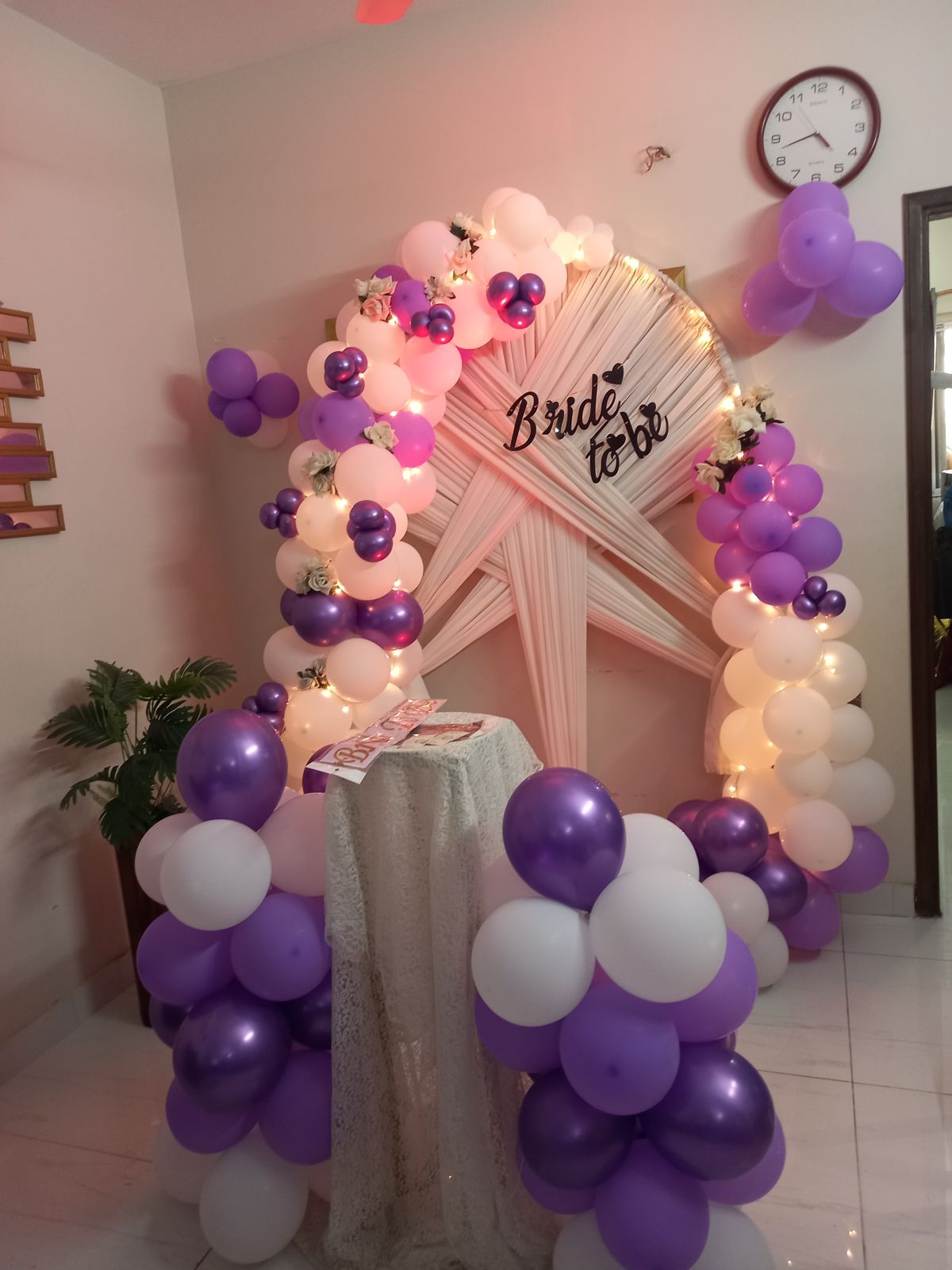 Purple and white bridal shower decor Karachi with bride to be arch, fairy lights and balloon pillars – image 2