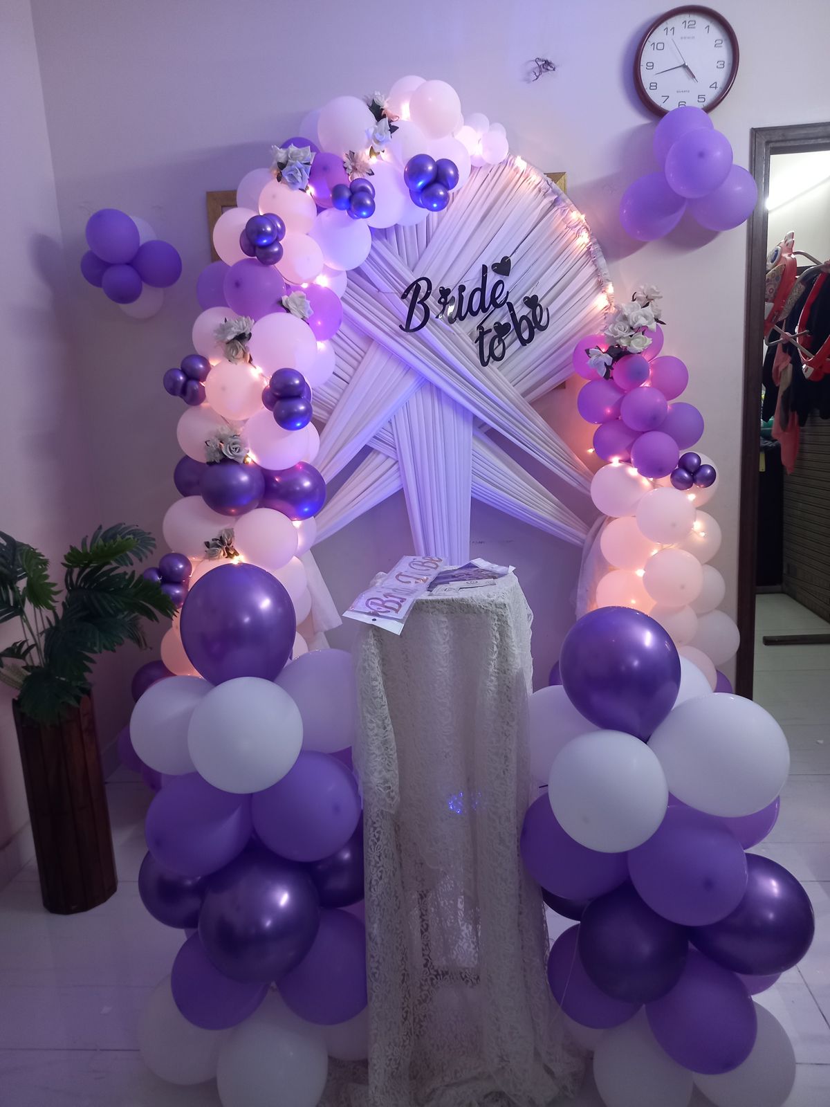 Purple and white bridal shower decor Karachi with bride to be arch, fairy lights and balloon pillars – image 3