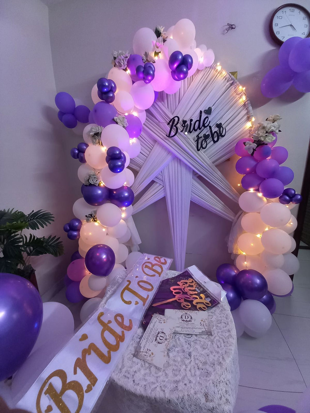 Purple and white bridal shower decor Karachi with bride to be arch, fairy lights and balloon pillars – image 4
