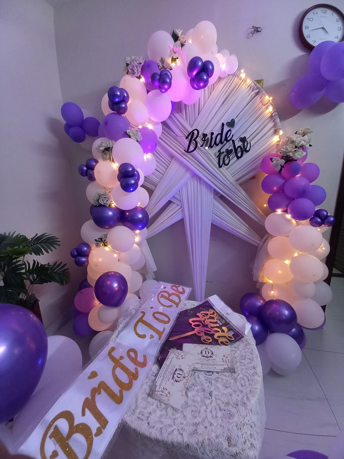 Purple and white bridal shower decor Karachi with bride to be arch, fairy lights and balloon pillars – image 4