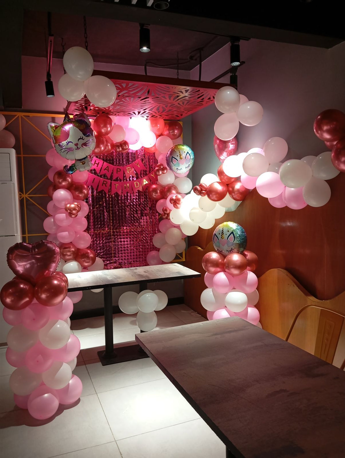 Restaurant Birthday Decor – Pink & White Balloon Pillars with Fringe Curtain Backdrop