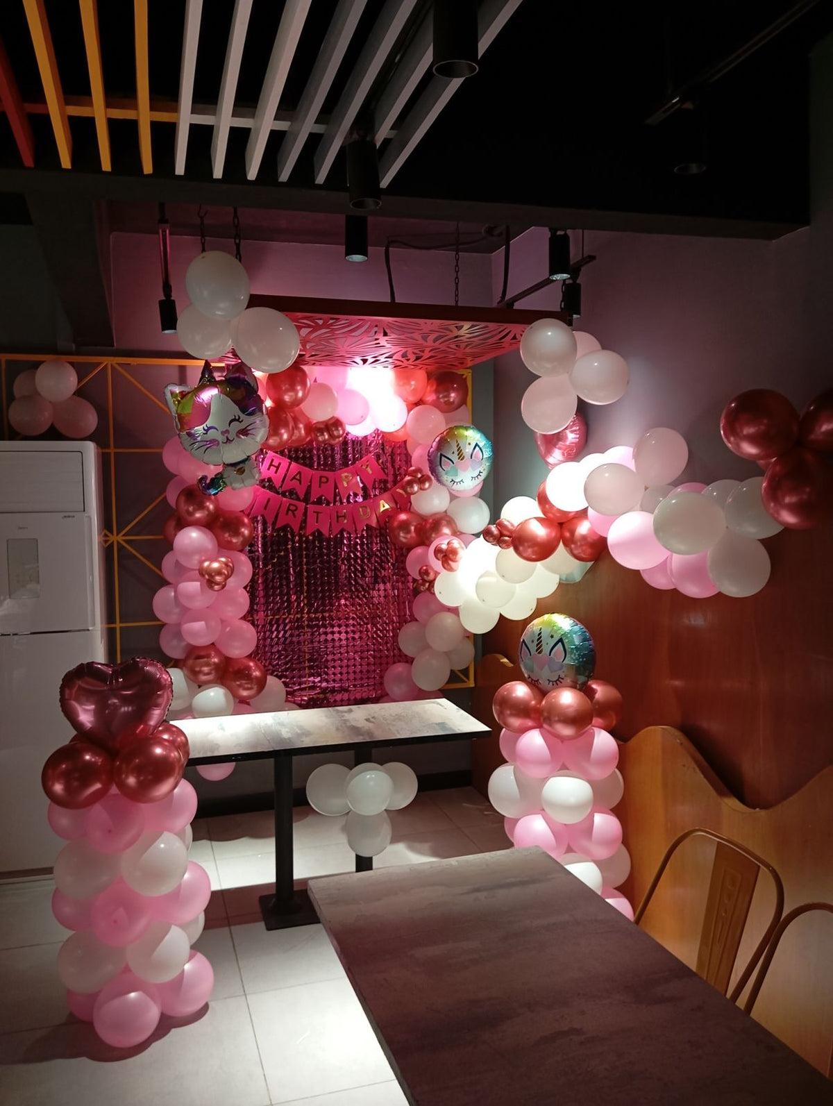 Restaurant Birthday Decor – Pink & White Balloon Pillars with Fringe Curtain Backdrop
