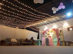 Rooftop bridal shower decoration Karachi with bride to be neon sign, pink balloon garland and fairy lights – image 11
