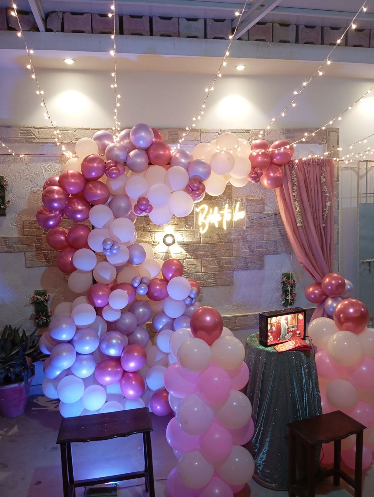 Rooftop bridal shower decoration Karachi with bride to be neon sign, pink balloon garland and fairy lights – image 4