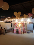 Rooftop bridal shower decoration Karachi with bride to be neon sign, pink balloon garland and fairy lights – image 5