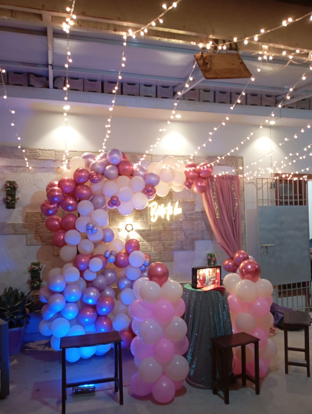 Rooftop bridal shower decoration Karachi with bride to be neon sign, pink balloon garland and fairy lights – image 7