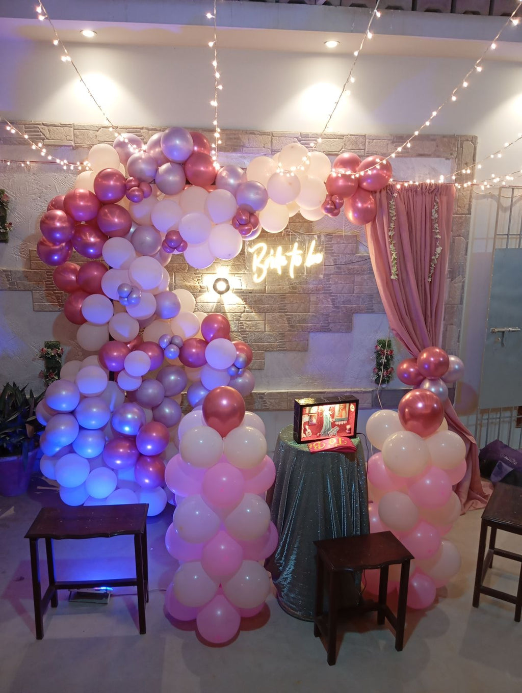 Rooftop bridal shower decoration Karachi with bride to be neon sign, pink balloon garland and fairy lights – image 8