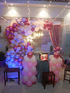 Rooftop bridal shower decoration Karachi with bride to be neon sign, pink balloon garland and fairy lights – image 8