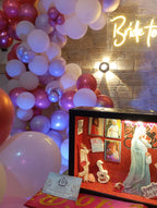 Rooftop bridal shower decoration Karachi with bride to be neon sign, pink balloon garland and fairy lights – image 9