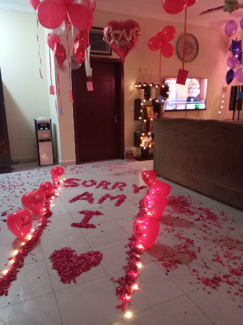 I am sorry surprise decoration Karachi with rose petal message and heart balloon pathway – image 1