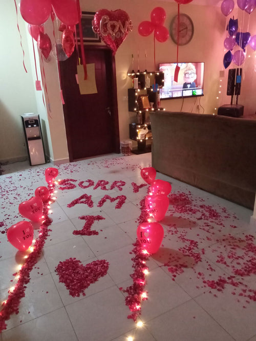 I am sorry surprise decoration Karachi with rose petal message and heart balloon pathway – image 2